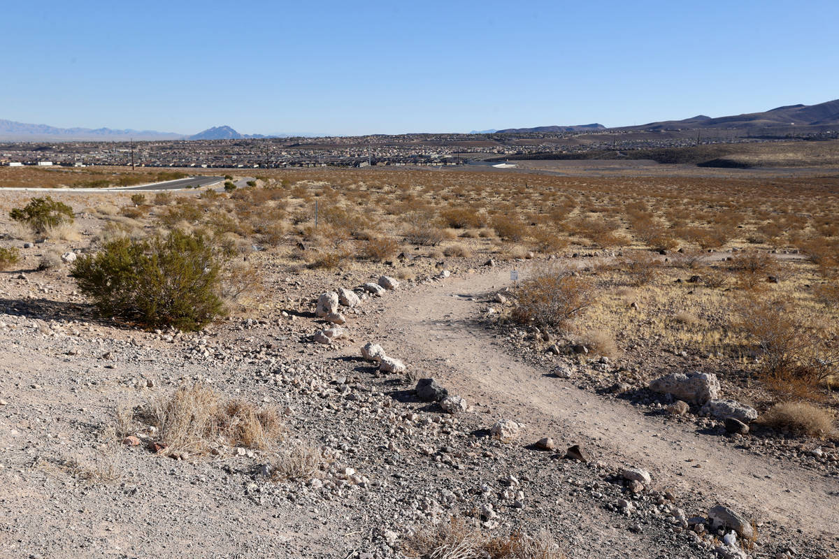 The Sloan 101 trailhead at the Visitor Contact Station parking lot at Sloan Canyon National Con ...