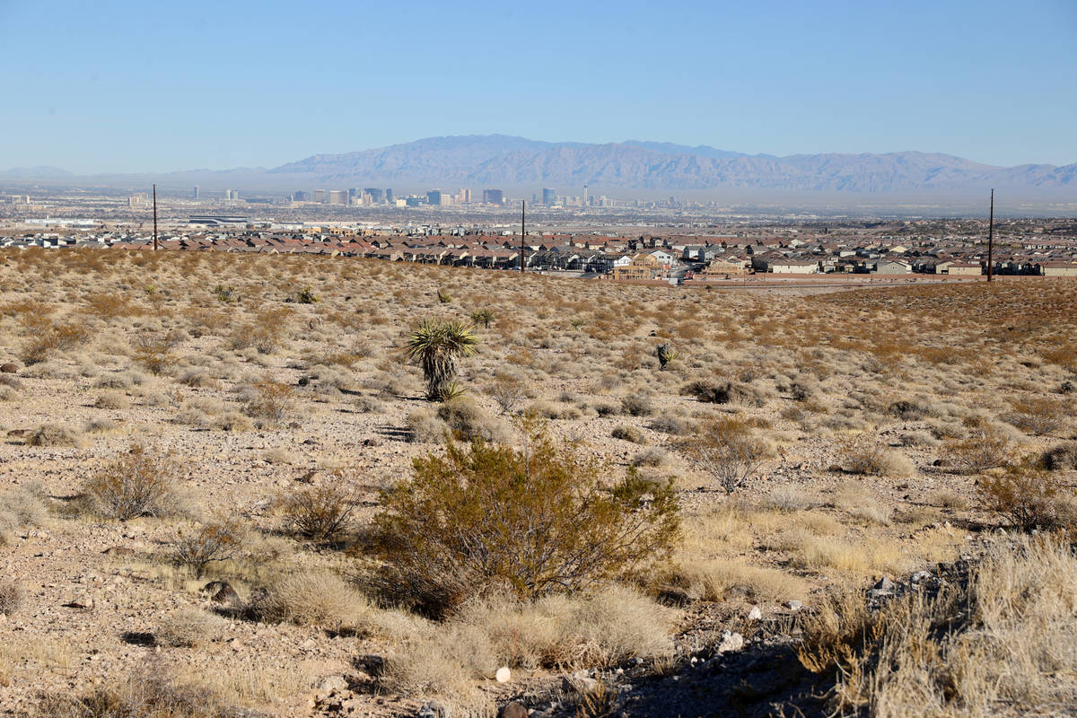 Henderson and the Strip are seen from the Visitor Contact Station parking lot at Sloan Canyon N ...