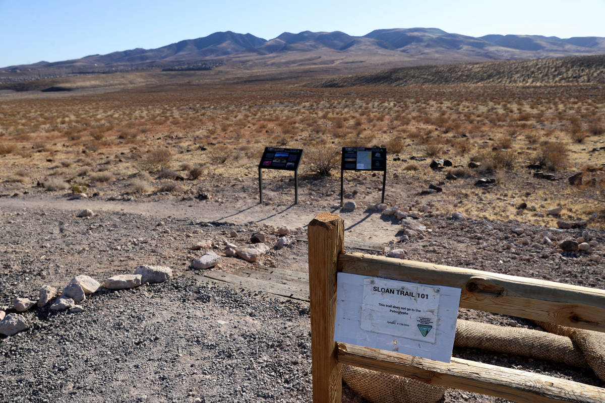 The Sloan 101 trailhead at the Visitor Contact Station parking lot at Sloan Canyon National Con ...