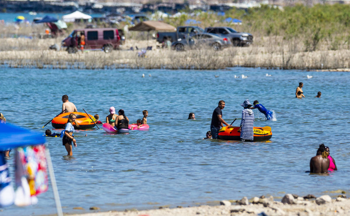 People relax in the water at Boulder Beach at Lake Mead National Recreation Area on Wednesday, ...