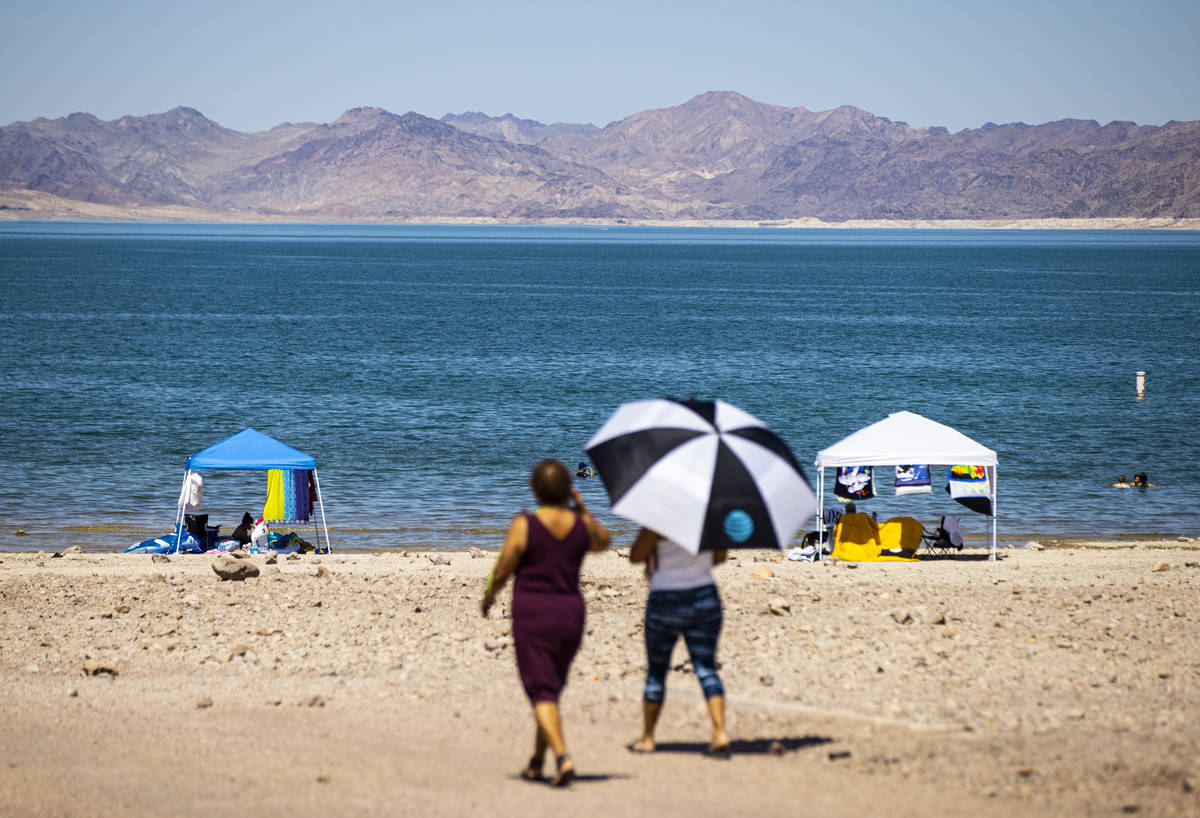 People walk to Boulder Beach at Lake Mead National Recreation Area on Wednesday, July 29, 2020. ...