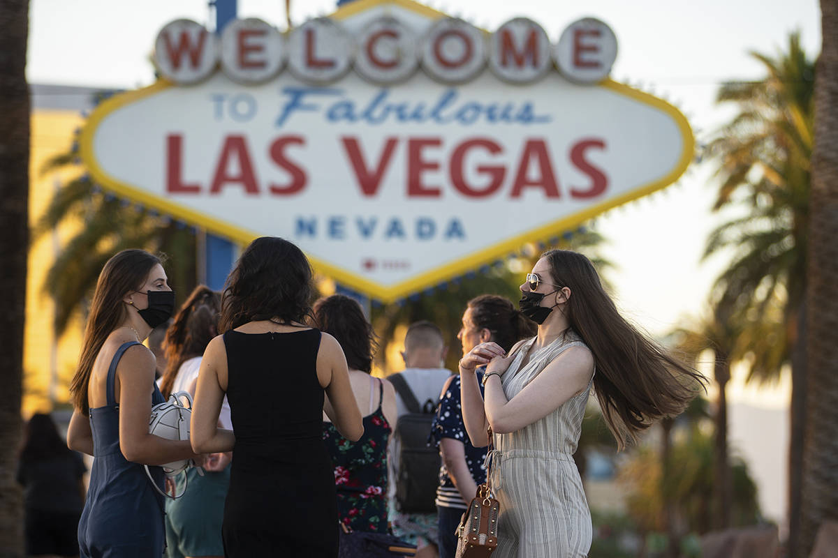 People wait in line to take photos at the Welcome to Fabulous Las Vegas Sign on Thursday, July ...