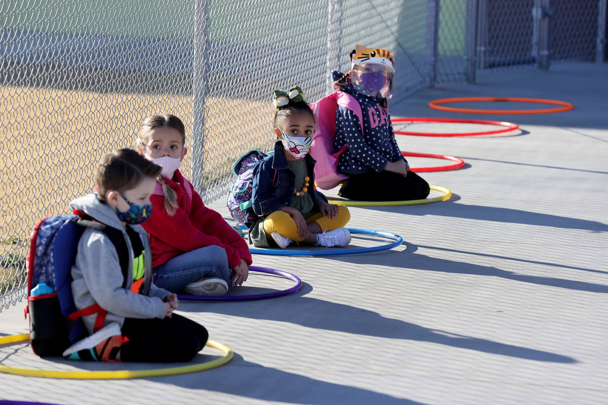 Pre-kindergarten students, from left, Maddux Barton, 5, Hannah Knight, 4, a student whose paren ...