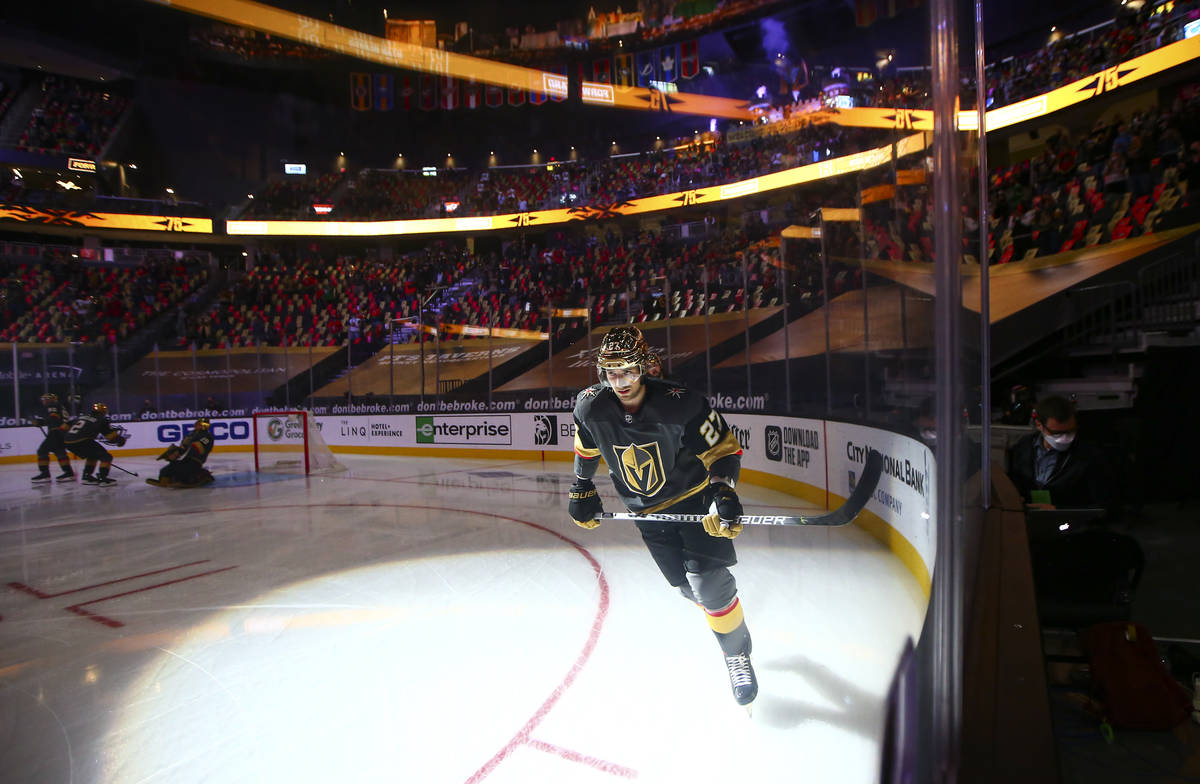 Golden Knights defenseman Shea Theodore (27) warms up before taking on the Minnesota Wild in an ...