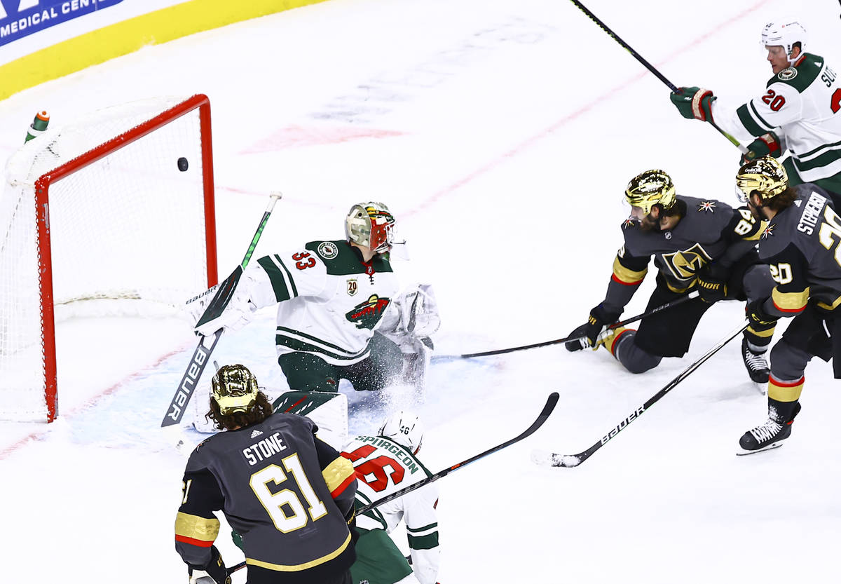 Golden Knights right wing Alex Tuch (89) scores a goal past Minnesota Wild goaltender Cam Talbo ...