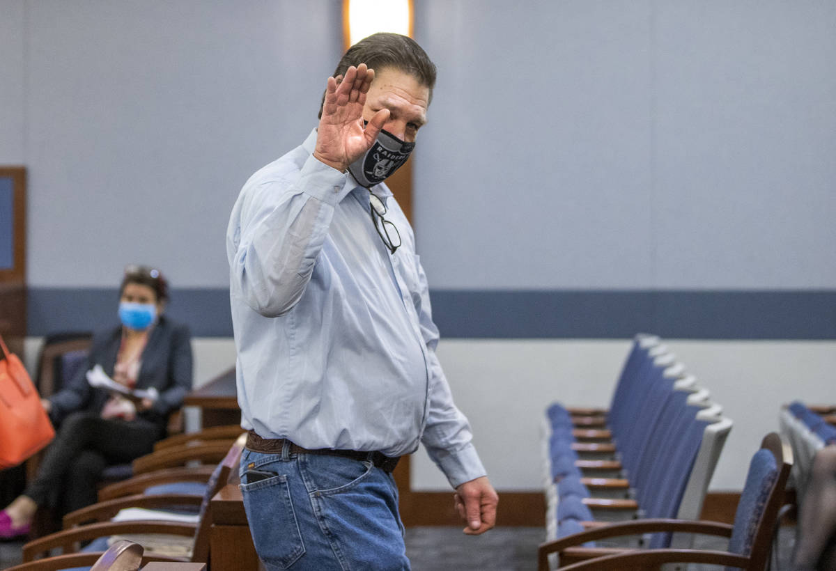 Fred Steese, right, exits the courtroom with a wave following his settlement hearing at the Reg ...