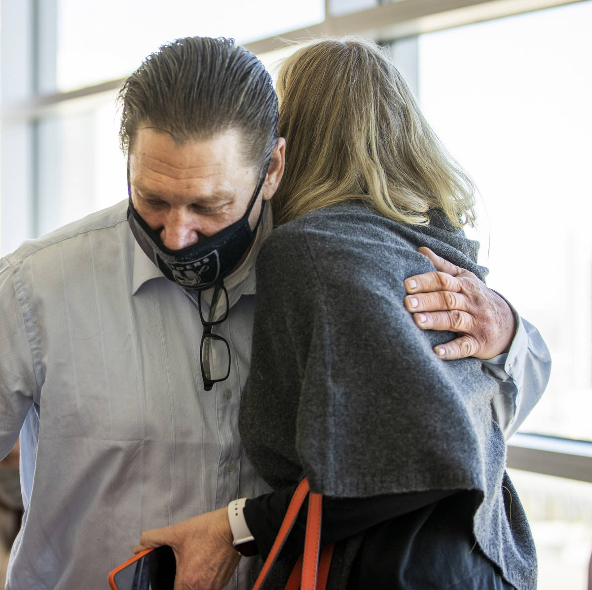 Fred Steese, left, hugs Nancy Lemcke following his settlement hearing on Monday, March 1, 2021, ...