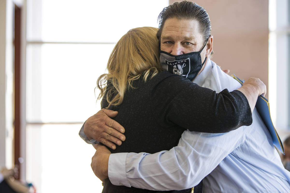 Fred Steese, right, hugs attorney Lisa Rasmussen following his settlement hearing at the Region ...