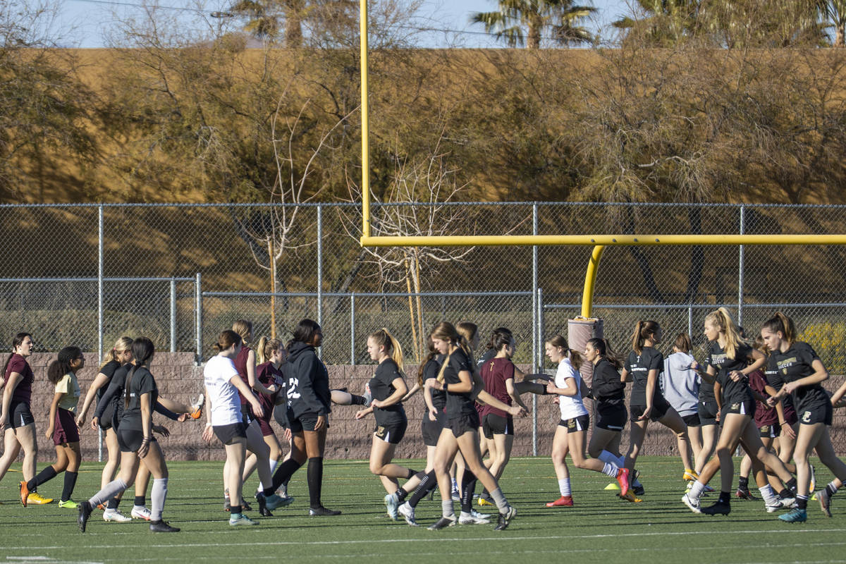 Players warm up during girlÕs soccer team practice at Faith Lutheran High School on Monday ...