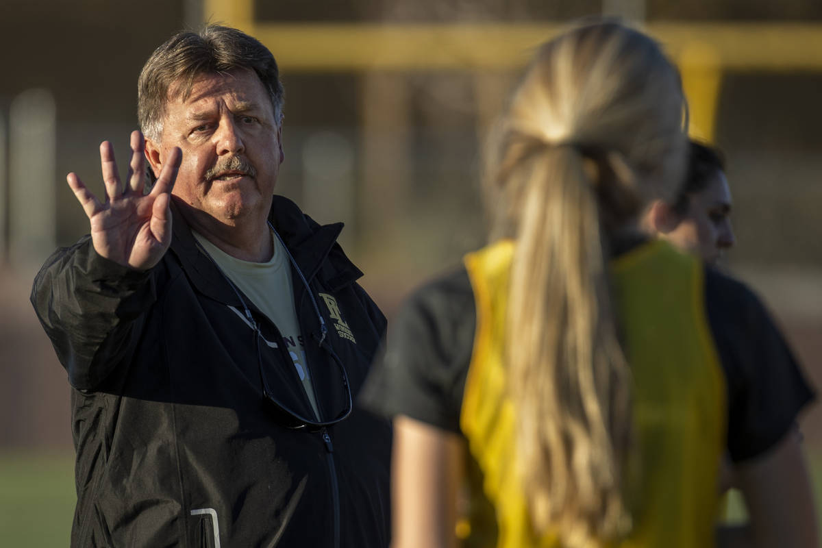 GirlÕs soccer team head coach Bob Chinn instructs his players during practice at Faith Lut ...