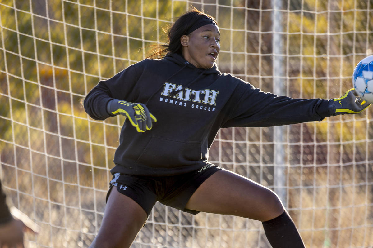 Goalkeeper Jordan Brown defends the net during a girlÕs soccer team practice at Faith Luth ...
