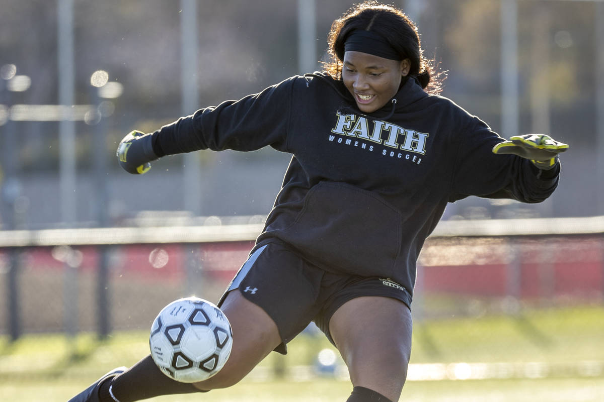 Goalkeeper Jordan Brown kicks a ball downfield during a girlÕs soccer team practice at Fai ...