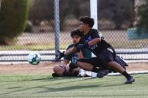 Equipo Academy goalkeeper Roberto Santana dives for the ball during soccer practice at Mike Mor ...