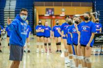 Varsity girlÕs volleyball coach Gregg Nunley instructs his players during practice at Bish ...
