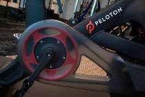 FILE-This Sept. 26, 2019, file photo shows the Peloton logo on the company's stationary bicycle ...