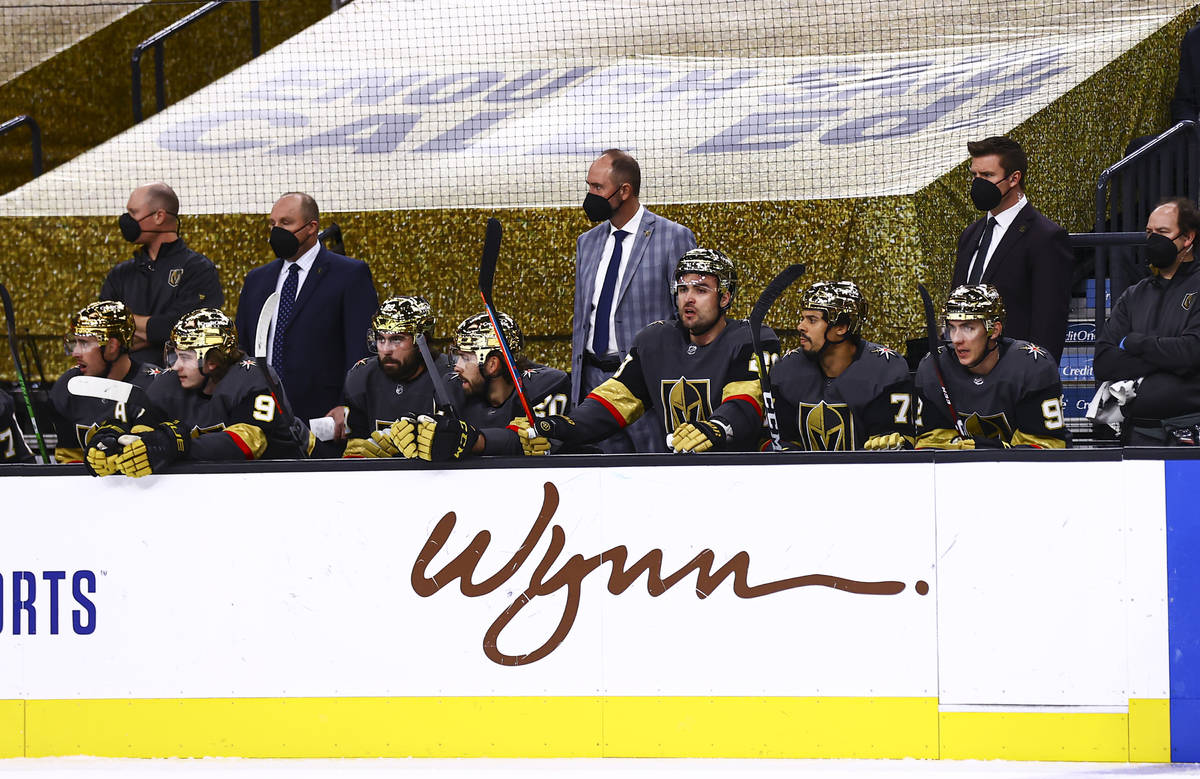 Golden Knights head coach Pete DeBoer looks on from the bench during the first period of an NHL ...