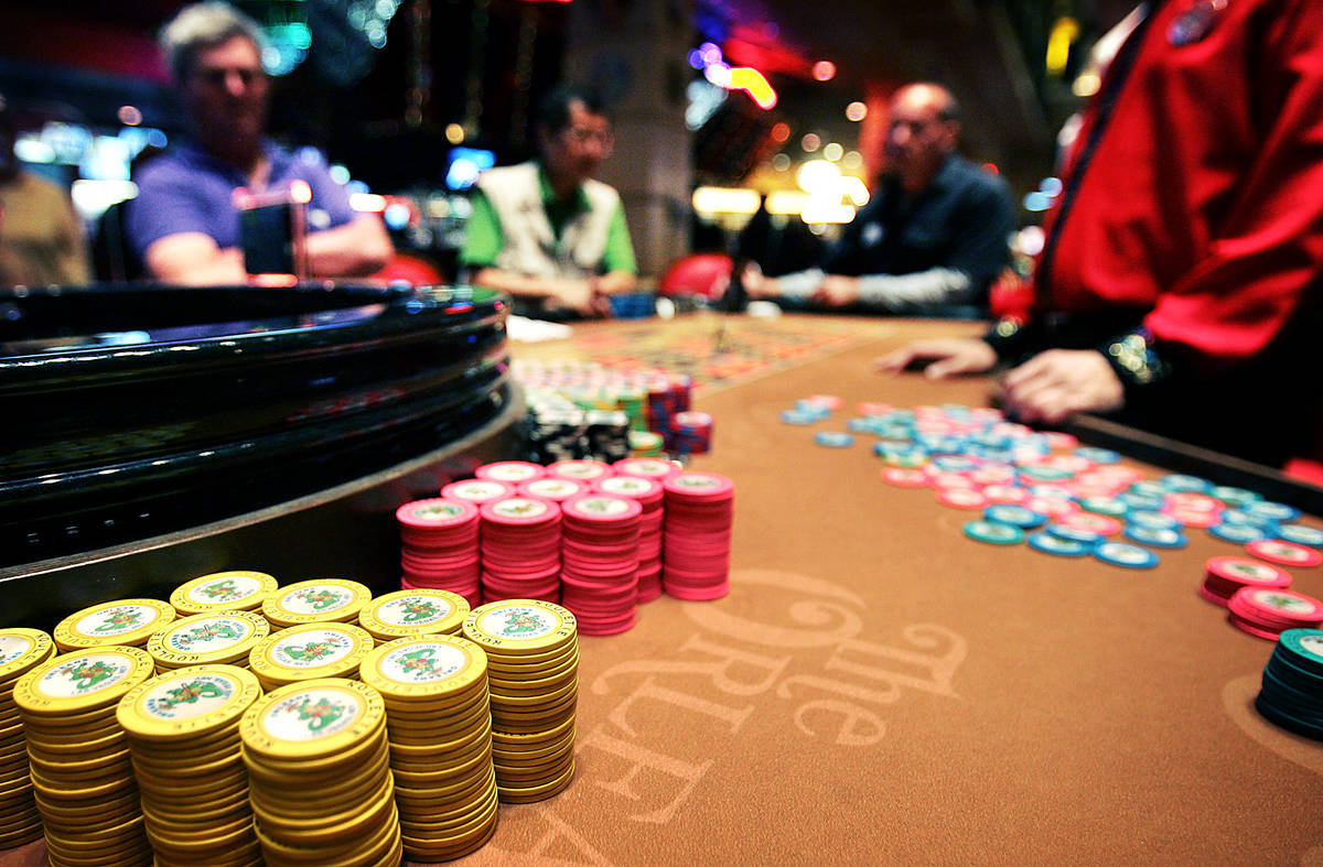Gamblers wait for the roulette ball to settle at Boyd Gaming Corp.'s Orleans hotel-casino in La ...