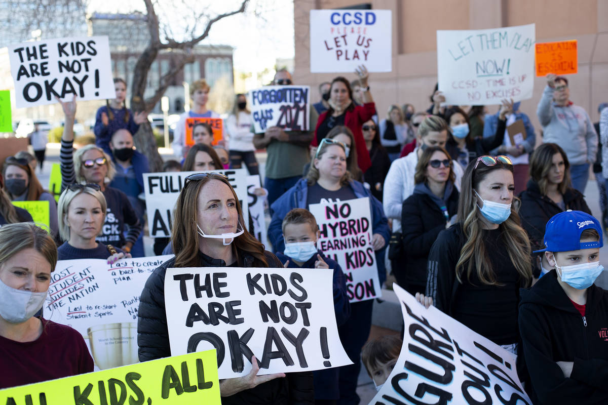 Parents and students attend a protest outside Las Vegas Academy of the Arts before a Clark Coun ...