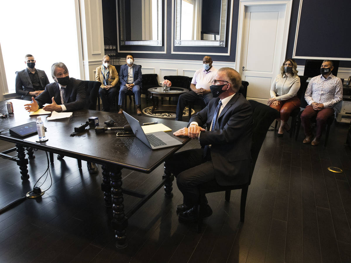 Attorney Will Kemp, second left, speaks during a press conference regarding a lawsuit against m ...