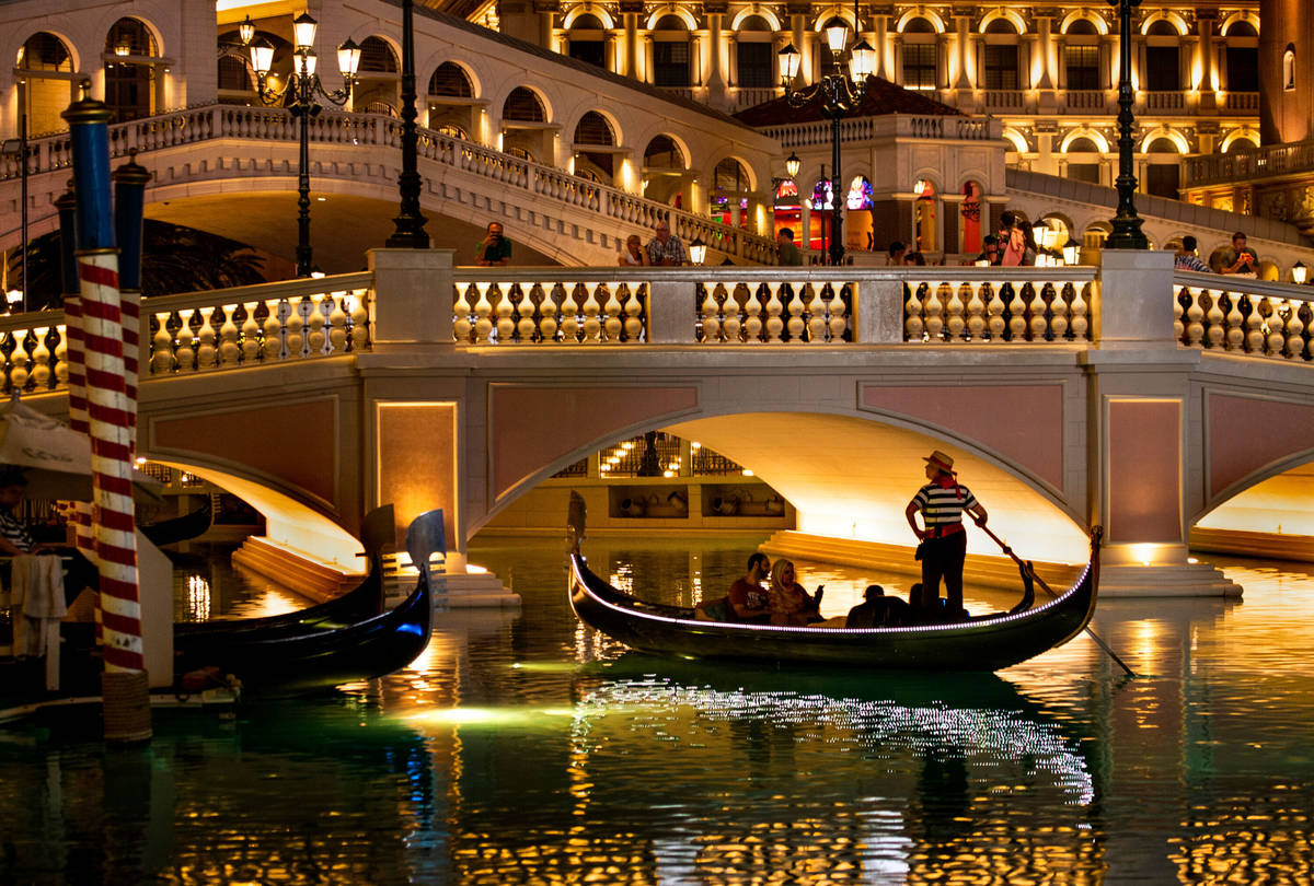 Tourists ride gondolas at The Venetian on Wednesday, April 24, 2019, in Las Vegas. (L.E. B ...