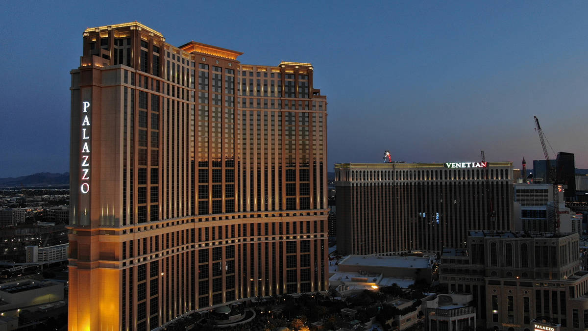 An aerial photo of the Palazzo and Venetian hotel casino properties at dusk, on Friday, April 3 ...