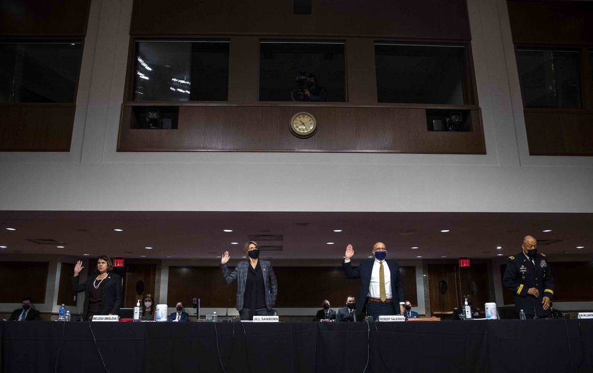 From left, Senior Department of Homeland Security official Office of Intelligence and Analysis ...