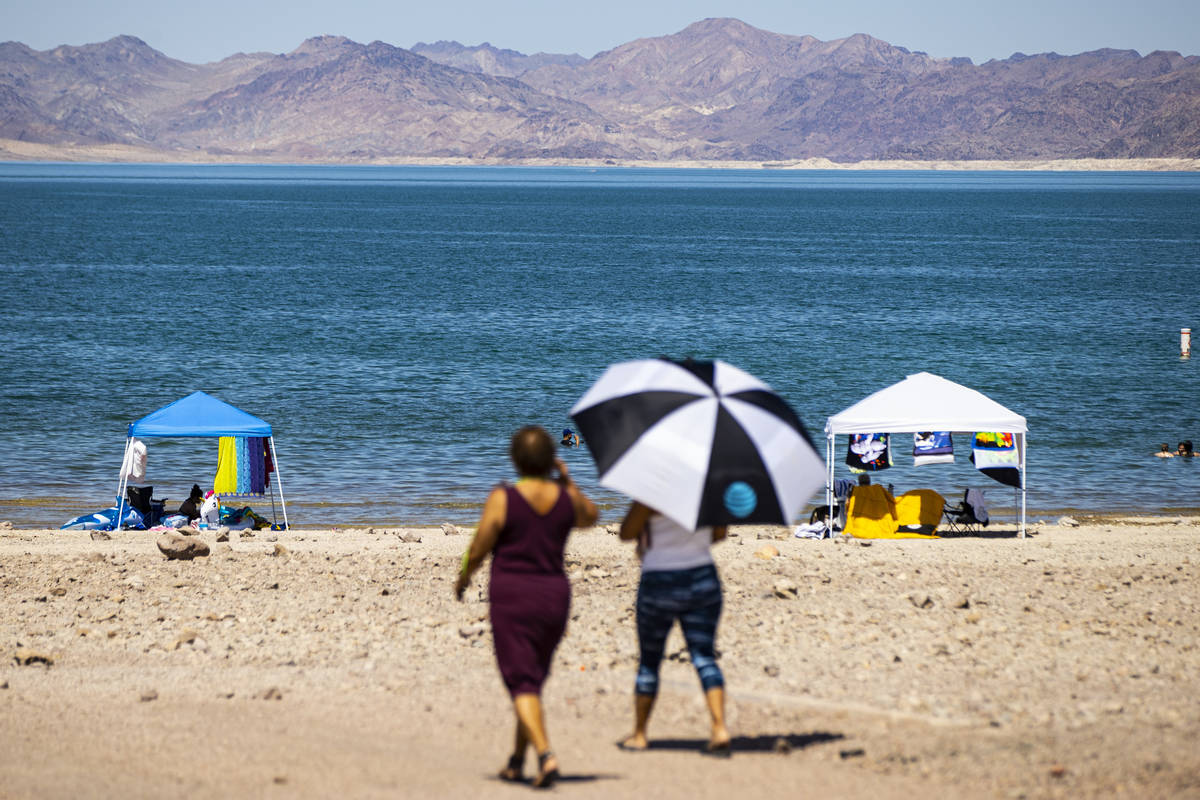 People walk to Boulder Beach at Lake Mead National Recreation Area on Wednesday, July 29, 2020. ...