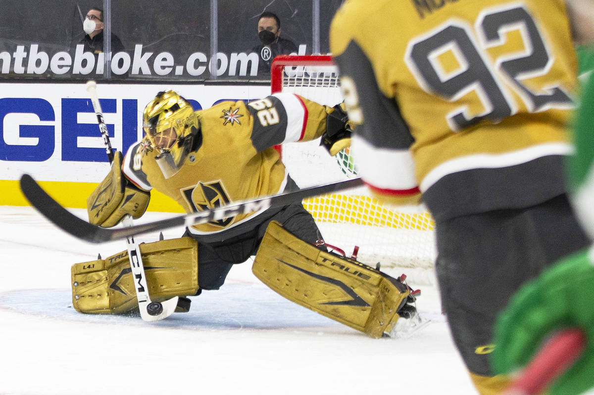 Golden Knights goaltender Marc-Andre Fleury (29) saves a shot on goal by the Minnesota Wild dur ...