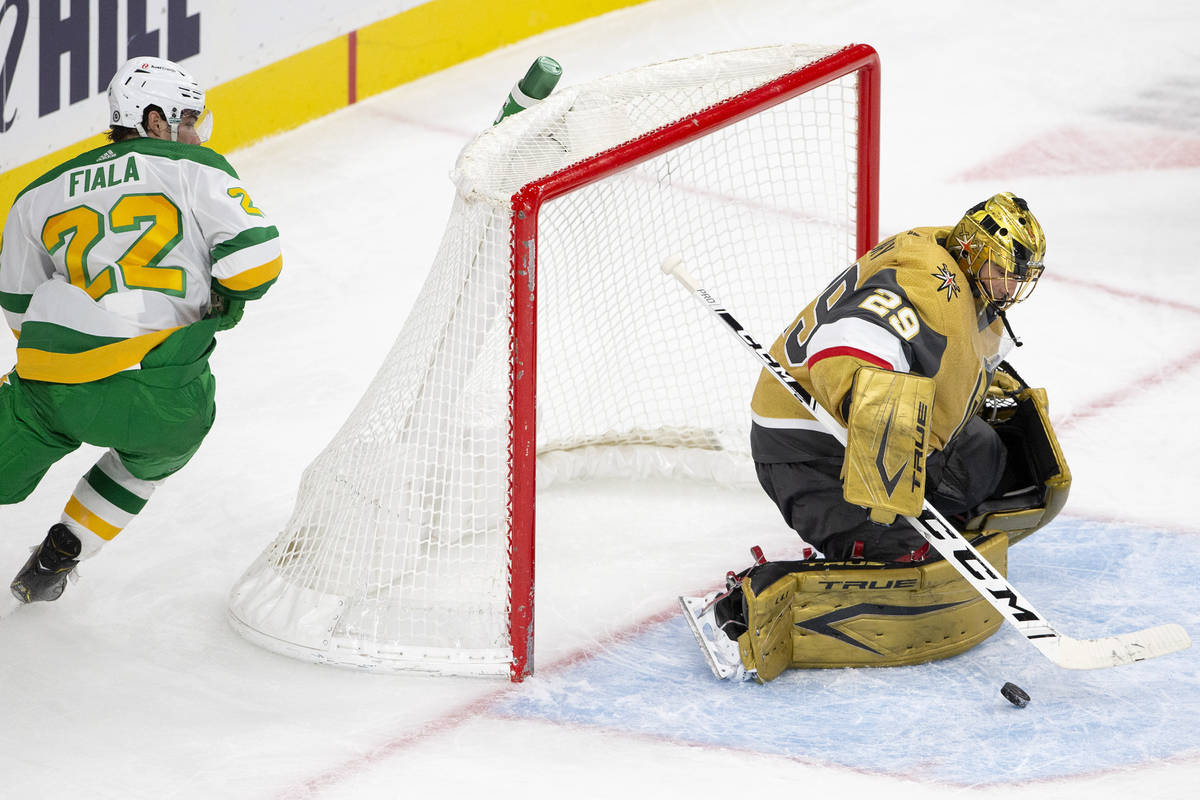 Golden Knights goaltender Marc-Andre Fleury (29) save a shot on goal from Wild left wing Kevin ...