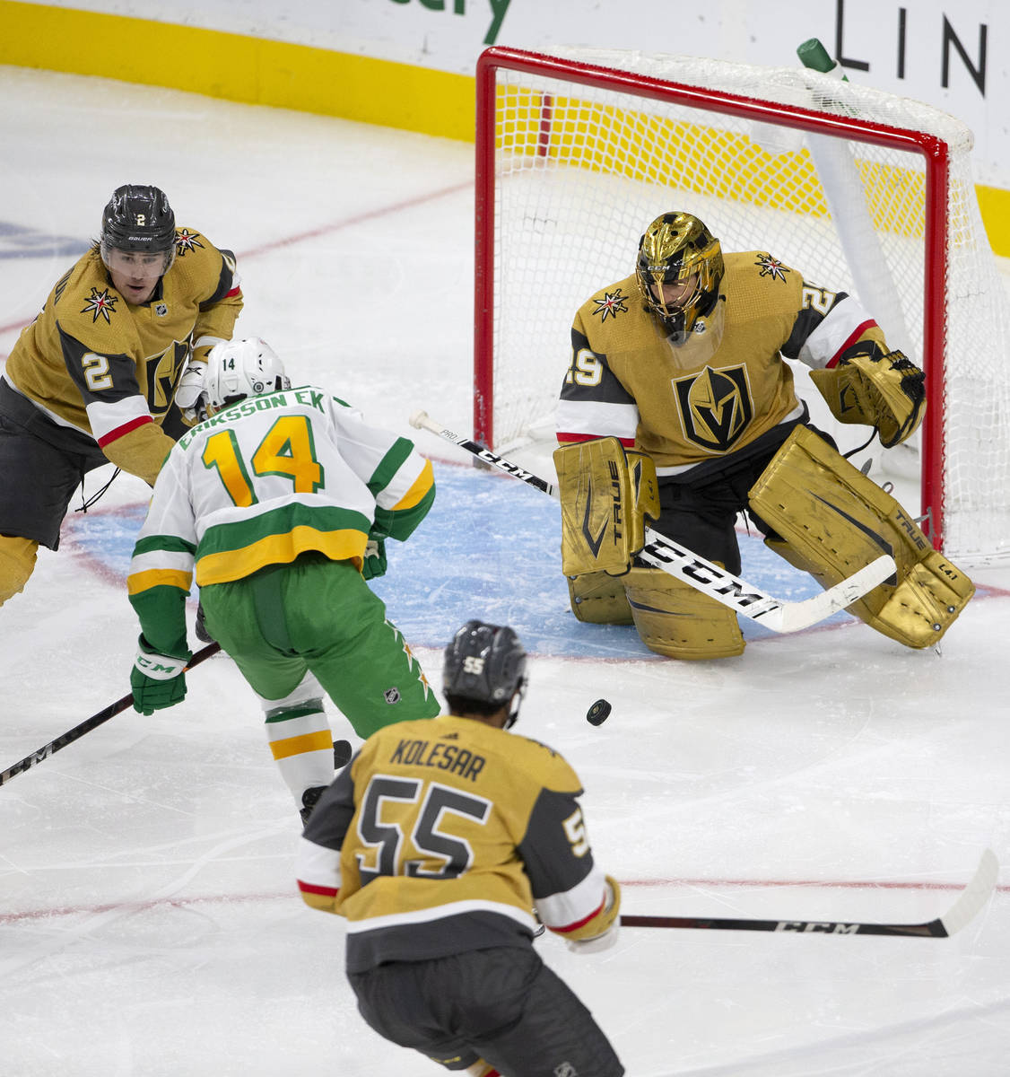 Golden Knights goaltender Marc-Andre Fleury (29) is about to save a shot on goal by Wild center ...