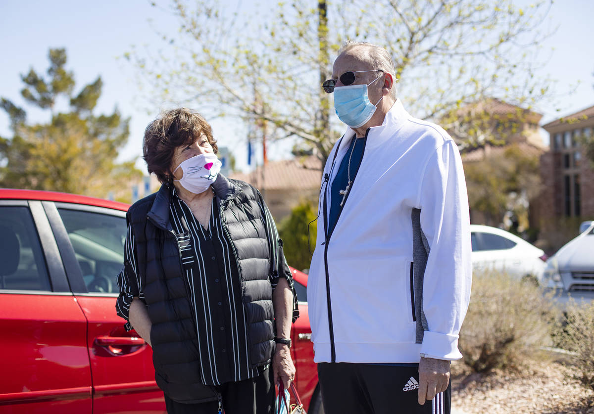 Sandra Hahnenkratt, left, listens as her husband Ronald Griebell, right, speaks to the Review-J ...