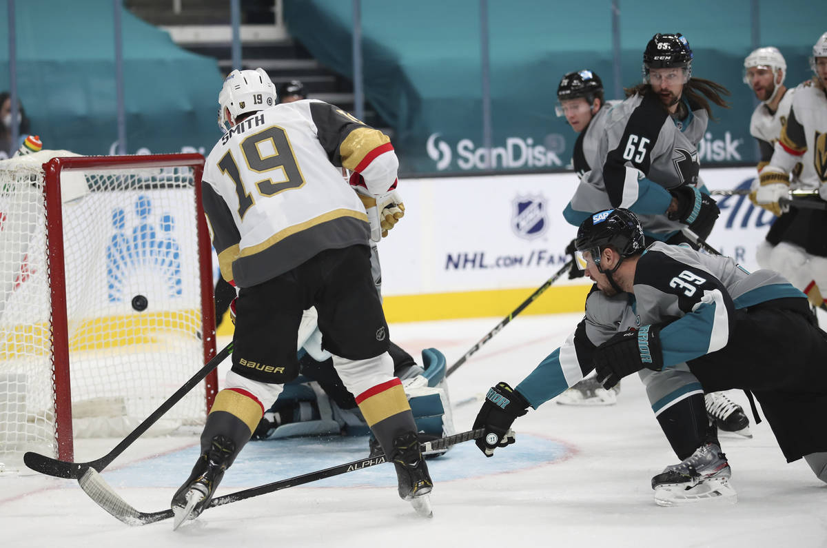 Vegas Golden Knights right wing Reilly Smith (19) scores a goal as San Jose Sharks center Logan ...