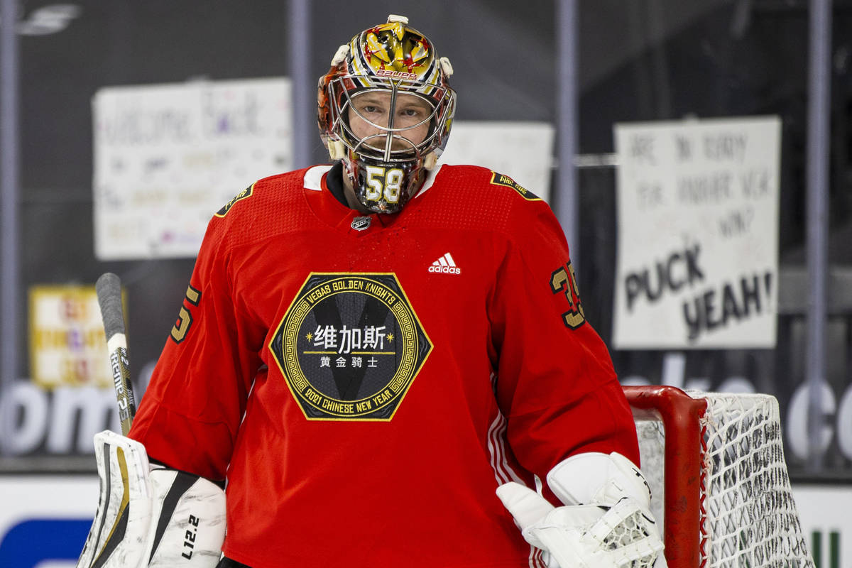 Golden Knights goaltender Oscar Dansk (35) looks on during warm ups before the first period of ...