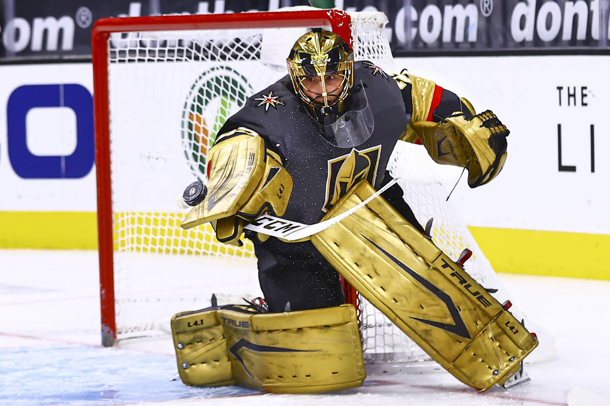 Golden Knights goaltender Marc-Andre Fleury (29) blocks the puck during the first period of an ...