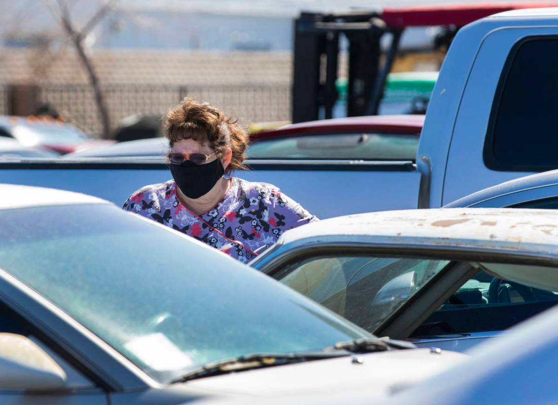 Dorothy LaMunyon arrives at Ashley Towing to retrieve her 1966 Mustang, right, that was stolen ...