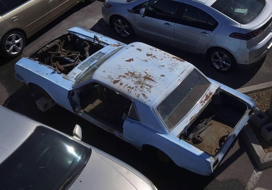 A 1966 Mustang that was stolen in 1983 from in front of Dorothy LaMunyon's house sits in Ashley ...