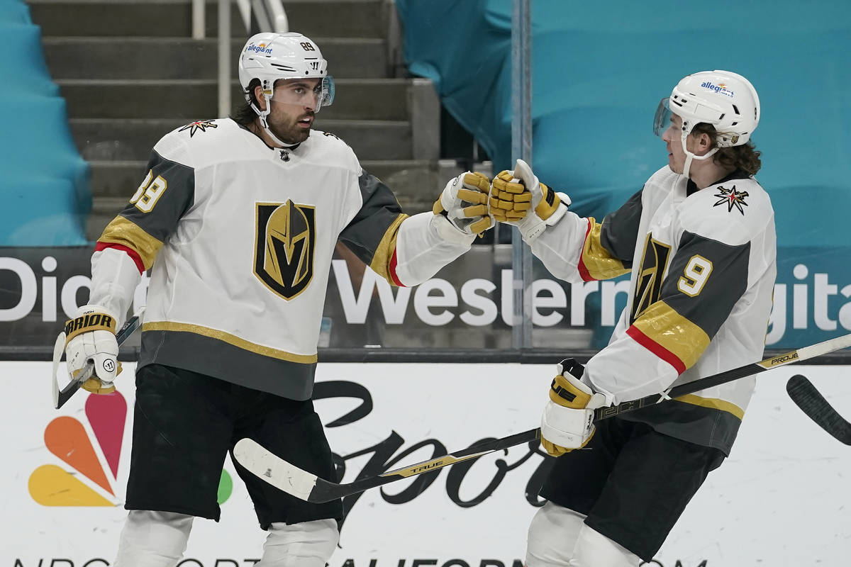 Vegas Golden Knights right wing Alex Tuch, left, is congratulated by center Cody Glass (9) afte ...