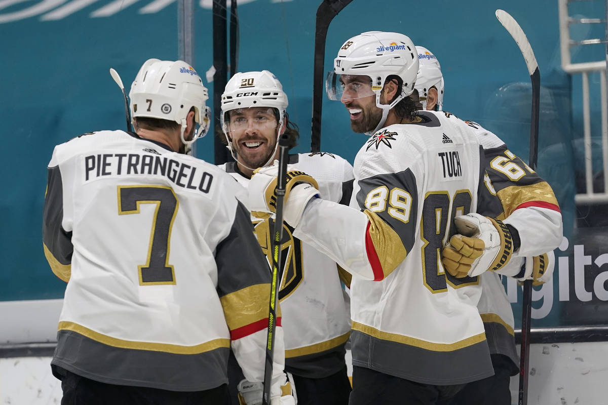 Vegas Golden Knights right wing Alex Tuch (89) celebrates with teammates after scoring a goal a ...