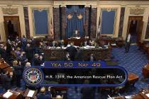 In this image from video, the vote total of 50-49 on Senate passage of the COVID-19 relief bill ...