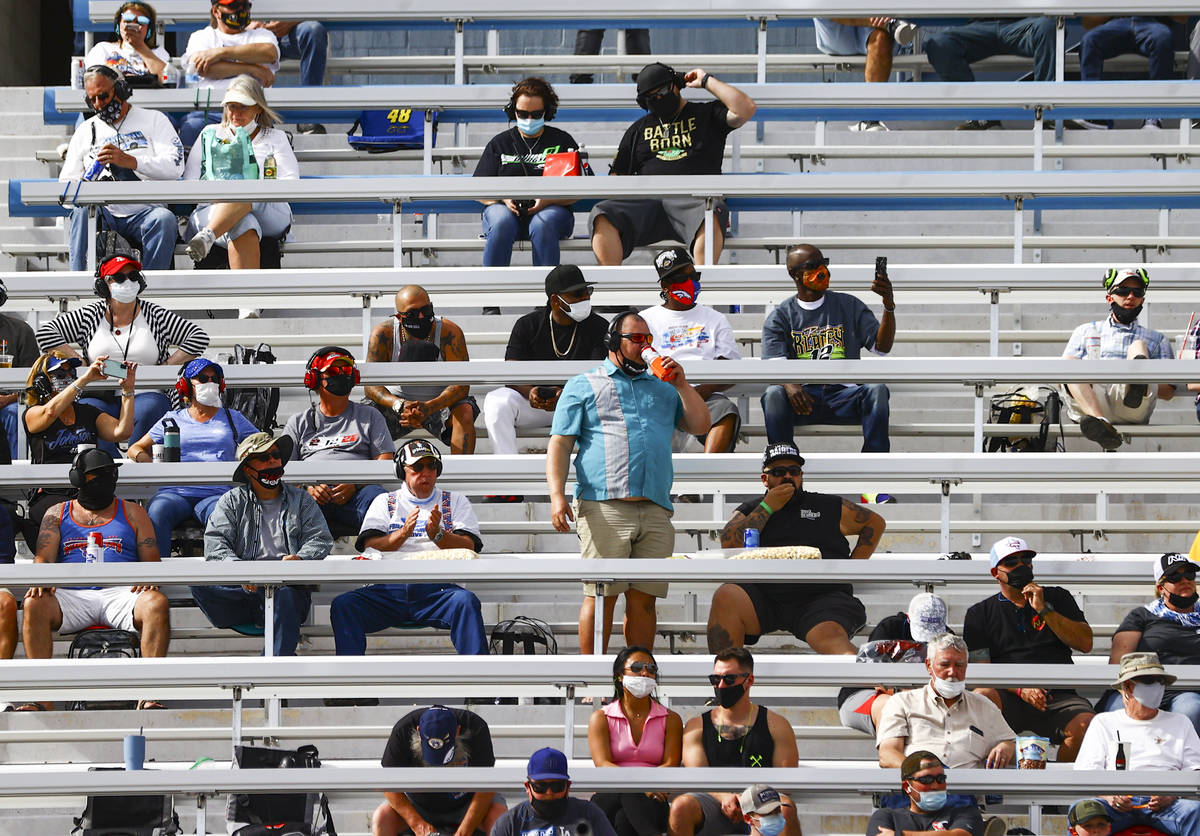 Fans take in the action during a NASCAR Xfinity Series auto race at the Las Vegas Motor Speedwa ...