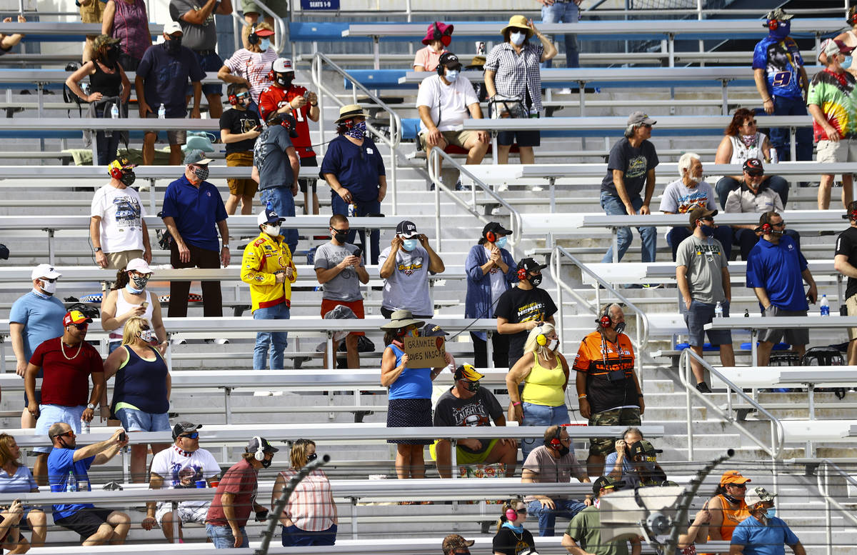 Fans take in the action during a NASCAR Xfinity Series auto race at the Las Vegas Motor Speedwa ...