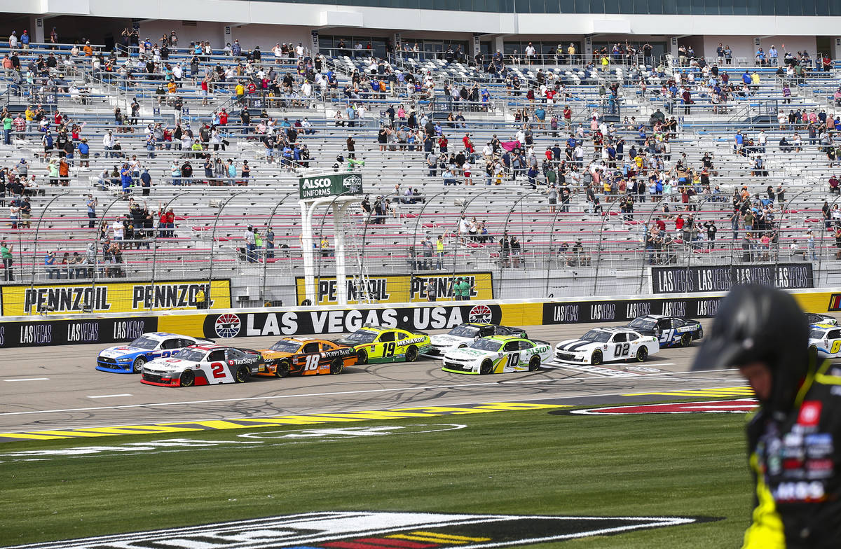 The green flag is waved at the start of a NASCAR Xfinity Series auto race at the Las Vegas Moto ...