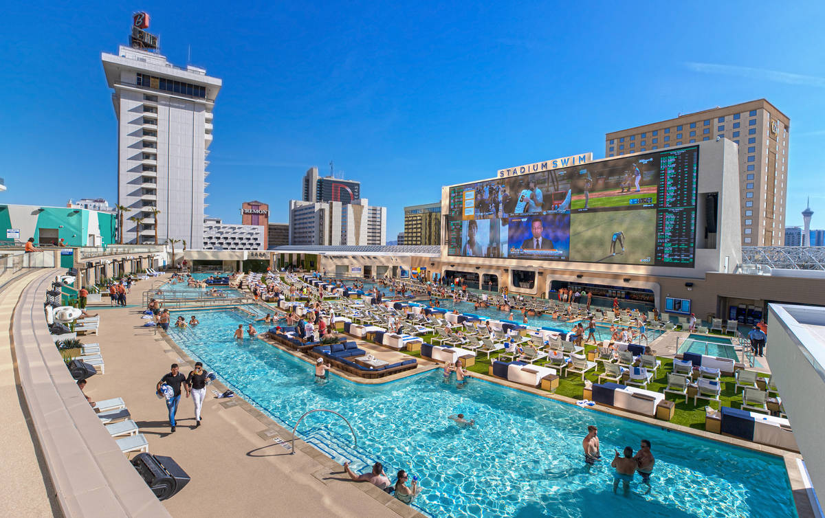 Guests lounge by the pool at Stadium Swim at Circa resort on Friday, March 5, 2021, in Las Vega ...