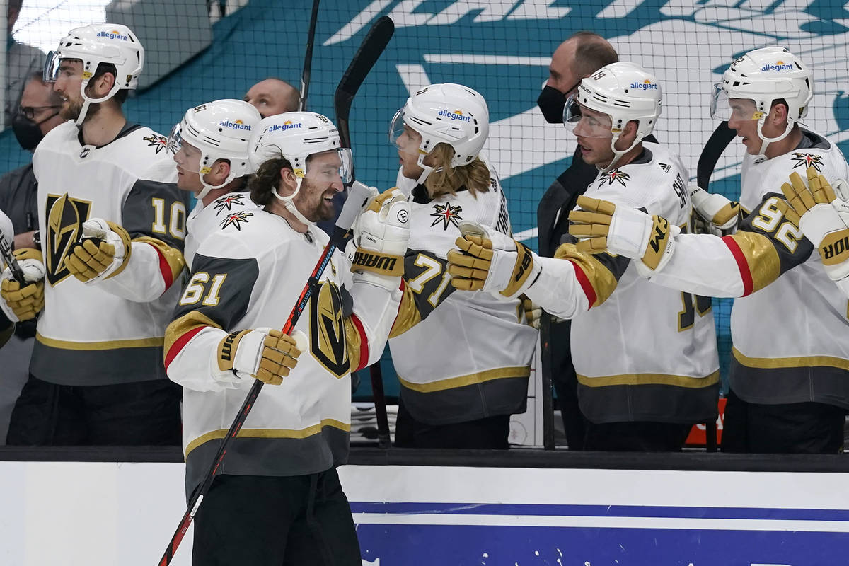 Vegas Golden Knights right wing Mark Stone (61) is congratulated by teammates after scoring a g ...