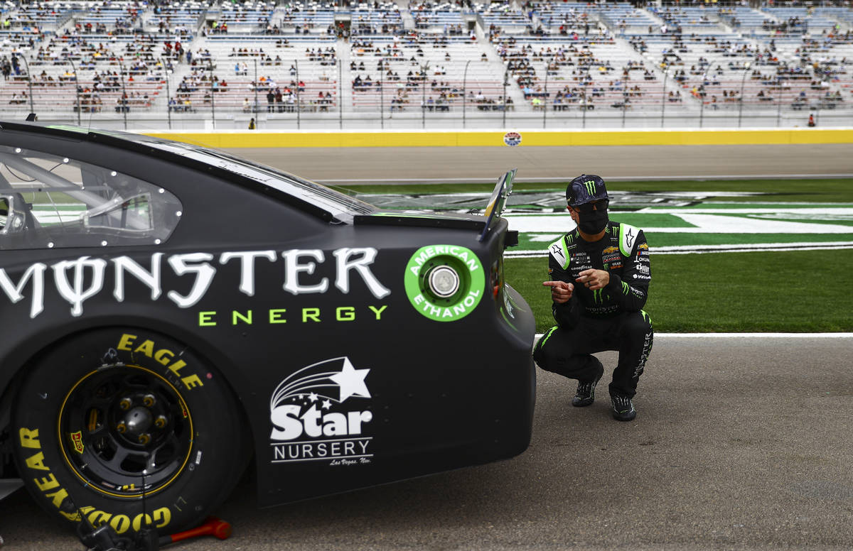 Kurt Busch poses for a photo by his car before the start of the NASCAR Cup Series Pennzoil 400 ...