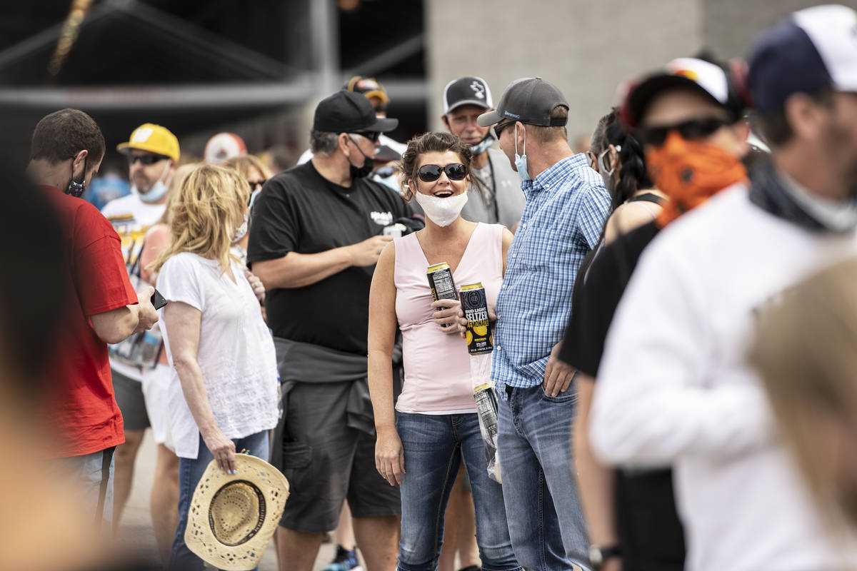 NASCAR fans socialize before the start of the NASCAR Cup Series Pennzoil 400 auto race at Las V ...