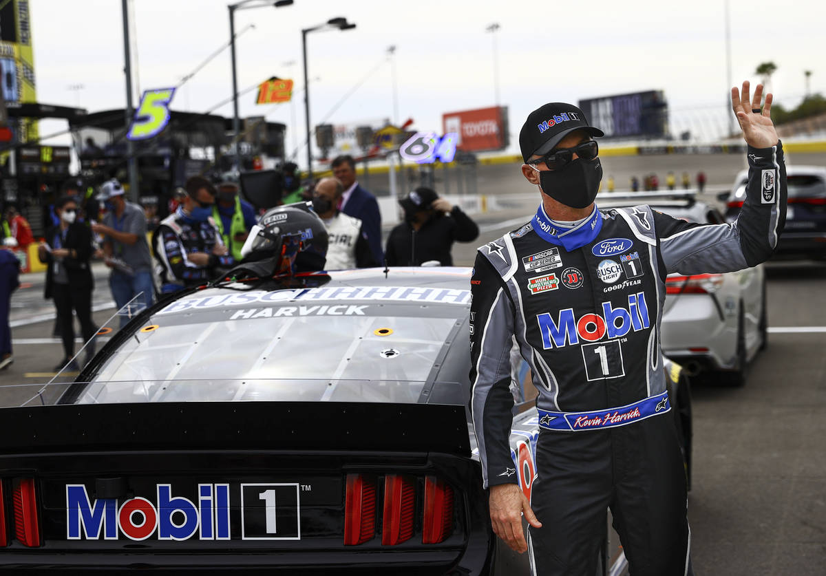 Kevin Harvick waves to fans during driver introductions before the start of a NASCAR Cup Series ...