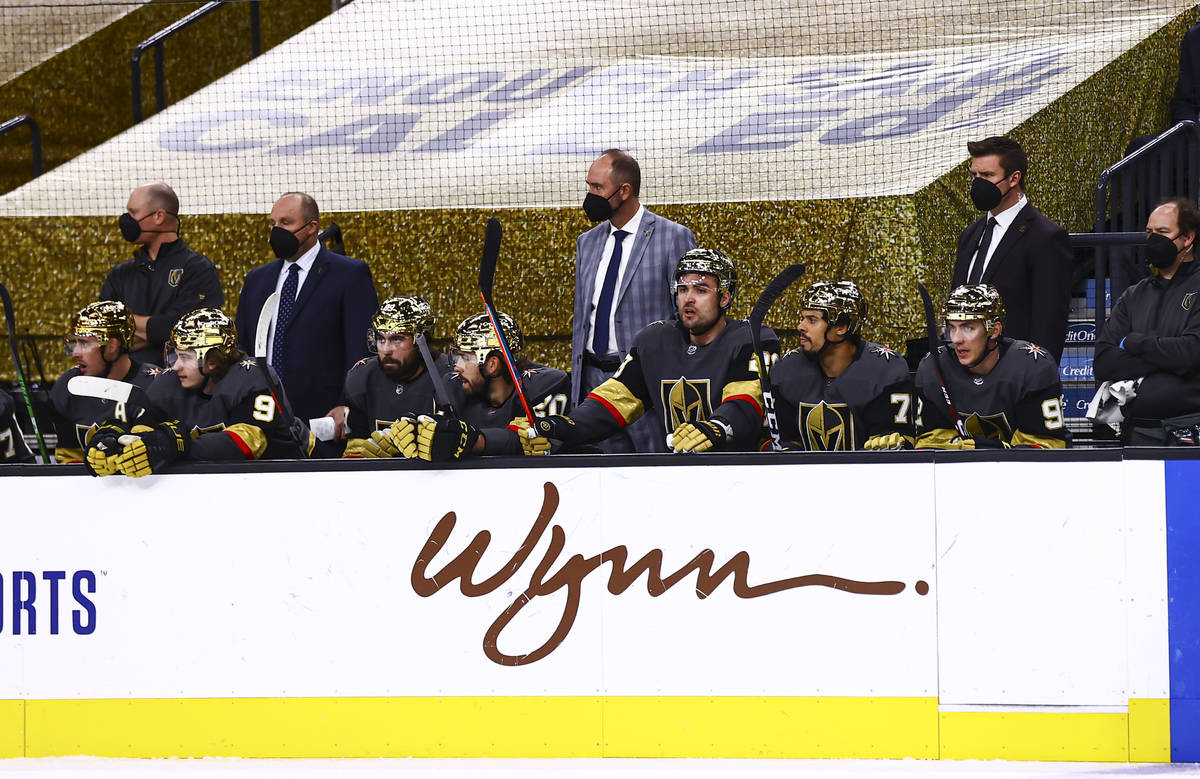 Golden Knights head coach Pete DeBoer looks on from the bench during the first period of an NHL ...