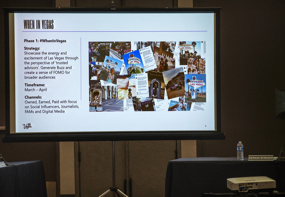 An information slide is seen on the screen as Kate Wik, chief marketing officer for the Las Veg ...