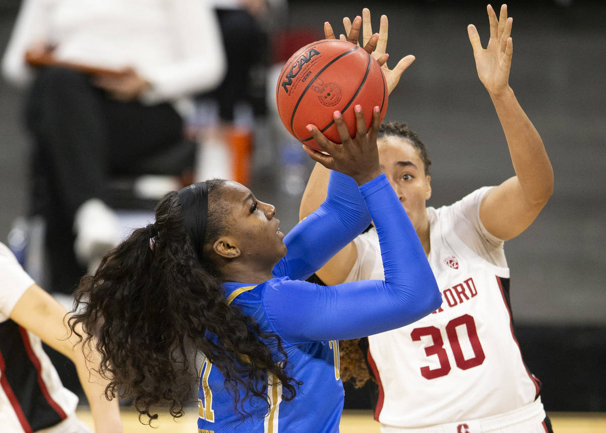 UCLA Bruins forward Michaela Onyenwere (21) attempts a point while Stanford Cardinal guard Hale ...
